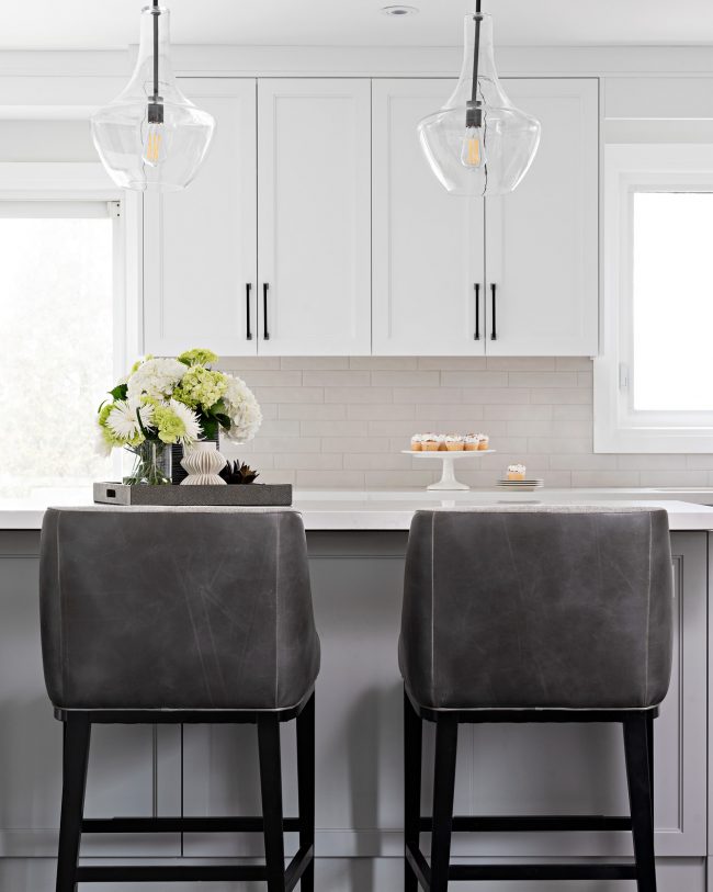 modern grey stool by kitchen island with 2 step shaker panel in white